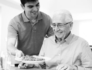 caregiver prepared meal for elderly man